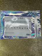 Sizing kit for false nails in a clear plastic package on a glittery black background