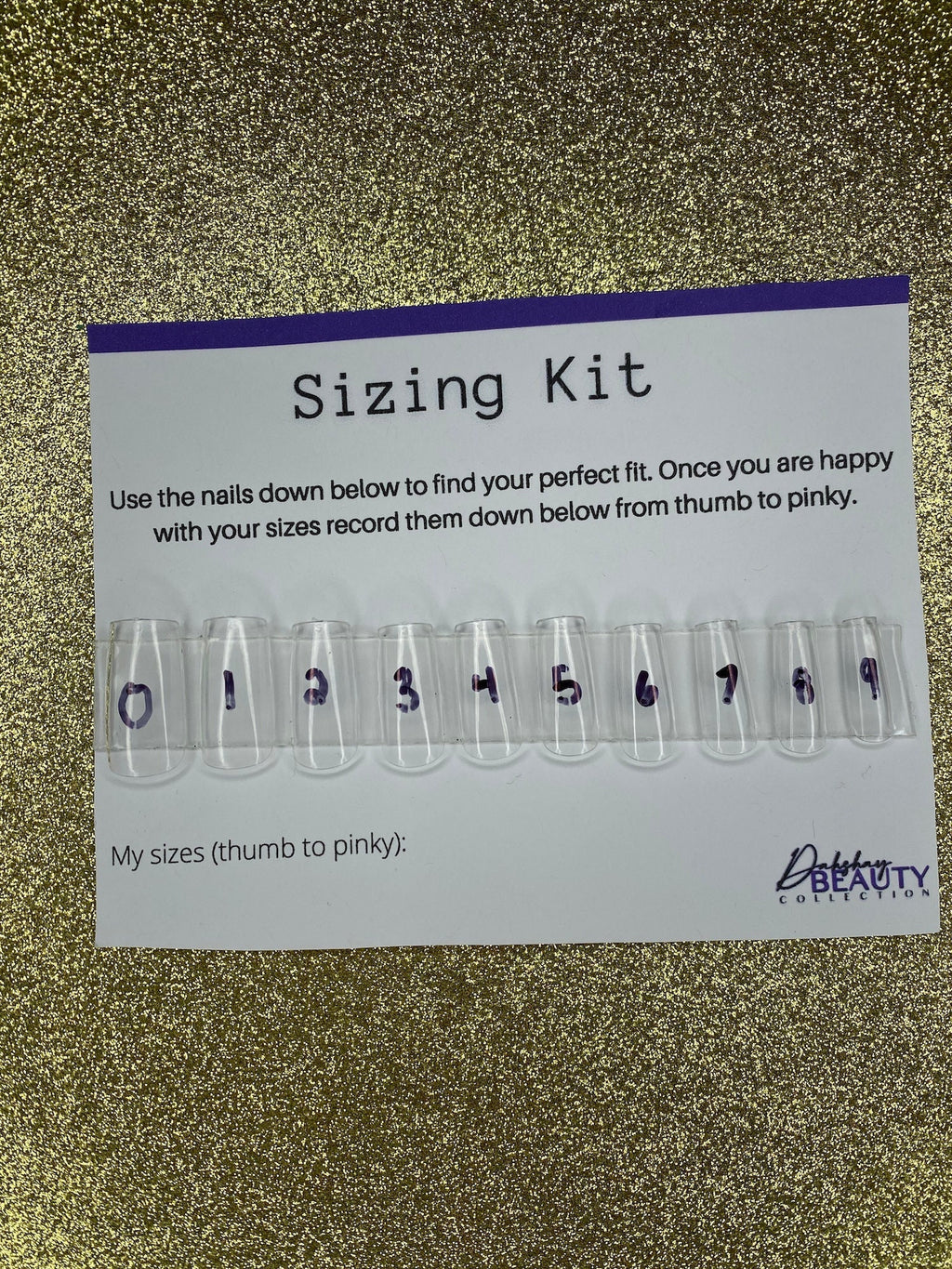 Sizing kit for false nails with measurement chart on a glittery background
