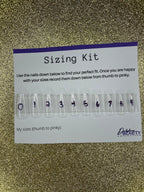 Sizing kit for false nails with measurement chart on a glittery background
