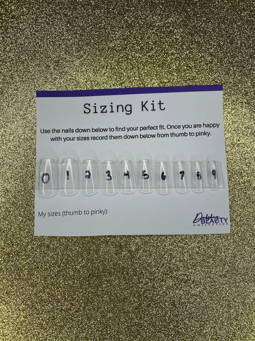 Nail sizing kit with clear nail forms and measurement labels on a gold glitter background.