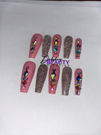 Pink and pink glitter press on nails with rhinestone decorations on a white background.